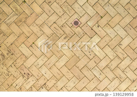 Looking down view of brown bricks used as outdoor flooring 139129958