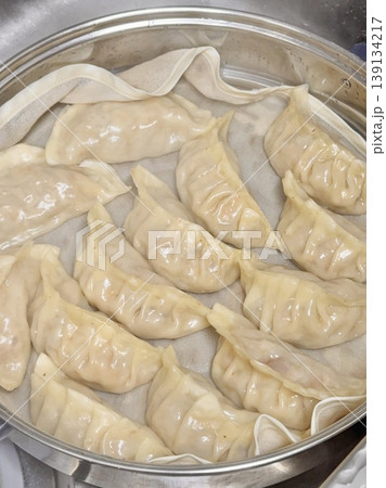 Korean dumplings filled with a mix of savory ingredients like ground meat, tofu, and vegetables. Mandu can be steamed, boiled, or pan-fried, making it a versatile and delicious snack or meal. 139134217
