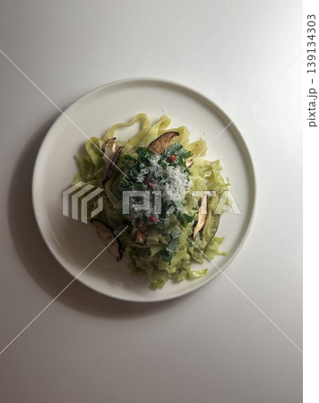 Spaghetti salad combines al dente pasta with fresh vegetables, tangy dressing, and optional herbs or cheese. A vibrant, refreshing dish perfect for light meals or gatherings. 139134303