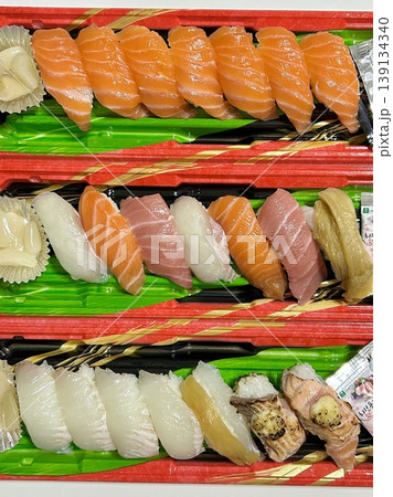 An assortment of fresh sushi, artfully arranged with a variety of toppings and vibrant colors. This traditional Japanese dish combines vinegared rice, seafood, and vegetables for an experience. An assortment of fresh sushi, artfully arranged with a variety of toppings and vibrant colors. This traditional Japanese dish combines vinegared rice, seafood, and vegetables for an experience. 139134340