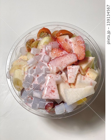 Hwachae, a refreshing Korean fruit punch made with colorful fruits and sweet syrup. Served chilled, it's a delightful treat for hot days, bursting with fruity flavors and vibrant colors. 139134567