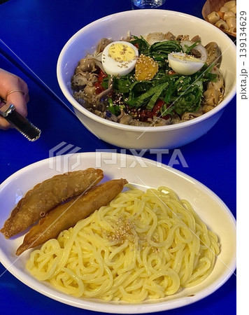 Creamy spaghetti carbonara made with rich egg yolk sauce, crispy bacon, parmesan cheese, and freshly ground black pepper for a classic, indulgent Italian pasta dish. 139134629