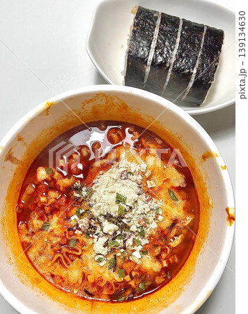 Spicy Shin ramyeon with bold, flavorful broth, served alongside fresh kimbap and tangy kimchi. A perfect trio of comforting, savory, and spicy Korean favorites in every bite. Spicy Shin ramyeon with bold, flavorful broth, served alongside fresh kimbap and tangy kimchi. A perfect trio of comforting, savory, and spicy Korean favorites in every bite. 139134630