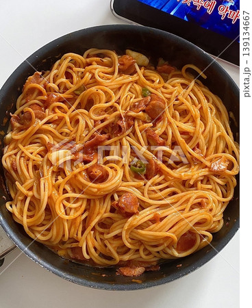 Classic spaghetti coated in rich tomato sauce, offering a simple yet delicious combination of tangy, savory flavors perfect for a comforting meal. Classic spaghetti coated in rich tomato sauce, offering a simple yet delicious combination of tangy, savory flavors perfect for a comforting meal. 139134667