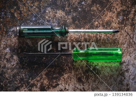 Two screwdrivers on rustic background for DIY concept with copy space. Two screwdrivers on rustic background for DIY concept with copy space. 139134836