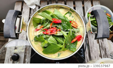 Homemade Thai Green Curry with Fresh Basil and Red Chilies in a Pot Homemade Thai Green Curry with Fresh Basil and Red Chilies in a Pot 139137987