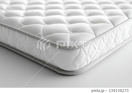 Mattress against white background. Memory foam mattress. Close up white orthopedic mattress corner, copy space for text. Hypoallergenic bed base for proper spinal alignment and pressure point relief. Mattress against white background. Memory foam mattress. Close up white orthopedic mattress corner, copy space for text. Hypoallergenic bed base for proper spinal alignment and pressure point relief. 139138273