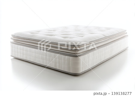 Mattress against white background. Memory foam mattress. Close up white orthopedic mattress corner, copy space for text. Hypoallergenic bed base for proper spinal alignment and pressure point relief. Mattress against white background. Memory foam mattress. Close up white orthopedic mattress corner, copy space for text. Hypoallergenic bed base for proper spinal alignment and pressure point relief. 139138277