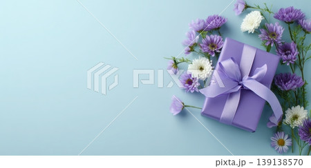Spring gift. Spring background. Purple Giftbox with flowers on light blue plain color backdrop. Flower pattern banner. Blossom abstract texture. Beautiful Floral wallpaper. Women Day, 8th March 8 card 139138570