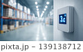 Industrial temperature digital display. A view inside a cold storage warehouse with shelves filled boxes. Gauges display measurements in a large manufacturing facility. Inventory control. Logistic 139138712