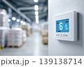 Industrial temperature digital display. A view inside a cold storage warehouse with shelves filled boxes. Gauges display measurements in a large manufacturing facility. Inventory control. Logistic 139138714