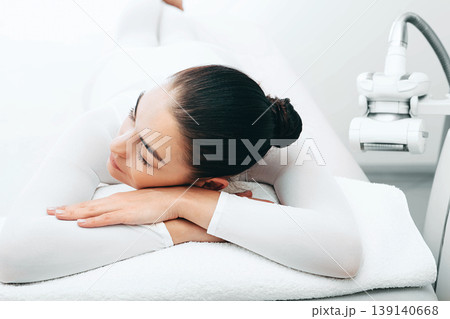 beautiful woman relaxes after lpg massage. Say goodbye to cellulite 139140668