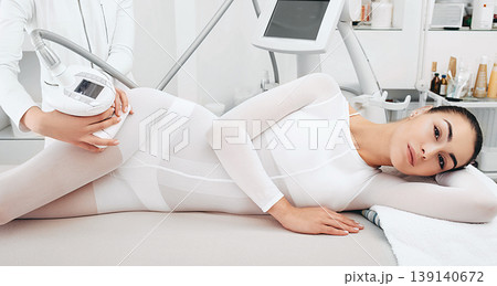 Lpg massage, a woman loses cellulite on her legs. Anti-cellulite massage procedure 139140672