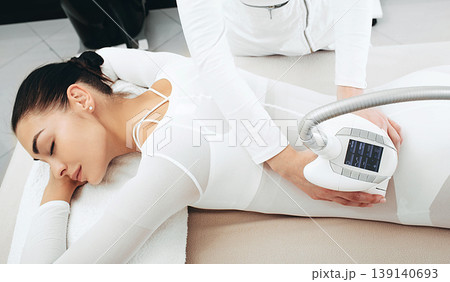 Body rejuvenation of a beautiful woman during a lpg massage. Removal of excess fluid, waste and toxins from the body 139140693