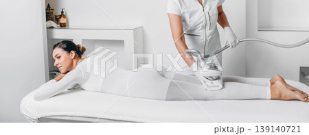 Beautiful woman having LPG massage for removing cellulite on body. cellulite treatment at beauty clinic 139140721