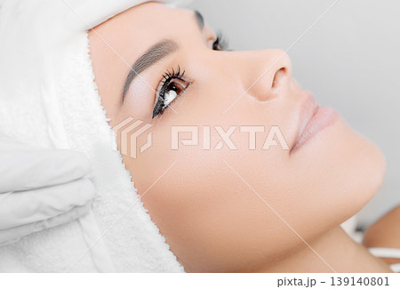 Close up of woman receiving beauty injection under eye 139140801
