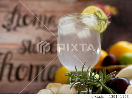 Lemonade specially made for a hot day with fresh fruits in the background. 139141198