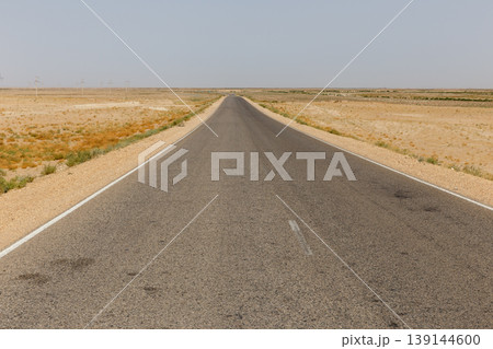 Long asphalt road from Sheberghan to Andkhoy in Jowzjan Province desert landscape Afghanistan Long asphalt road from Sheberghan to Andkhoy in Jowzjan Province desert landscape Afghanistan 139144600
