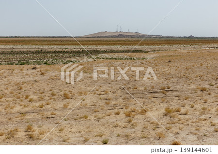 Arid desert landscape with communication towers on hill in Jowzjan Province Afghanistan area Arid desert landscape with communication towers on hill in Jowzjan Province Afghanistan area 139144601