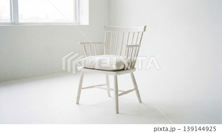 White wooden spindle-back armchair with a cushion in a bright room living room single object furniture piece armchair furniture interior traditional decoration isolated background 139144925