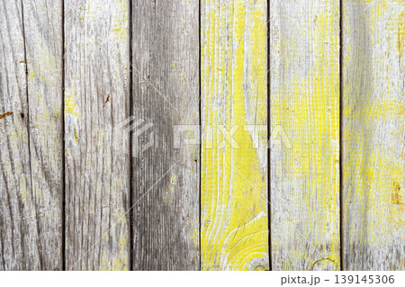 Weathered Wooden Planks Texture with Yellow Paint Background Weathered Wooden Planks Texture with Yellow Paint Background 139145306