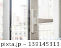 Open Window Handle with Natural Light in Modern Apartment 139145313