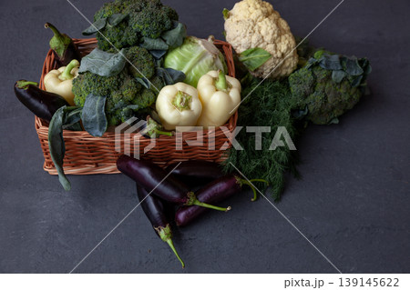Healthy food. Fresh vegetables on the table black background. Set of food clean eating. Broccoli, cabbage, eggplant, white cabbage, cucumber, onions, beets, dill, cauliflower. Top view. Copy space. Healthy food. Fresh vegetables on the table black background. Set of food clean eating. Broccoli, cabbage, eggplant, white cabbage, cucumber, onions, beets, dill, cauliflower. Top view. Copy space. 139145622