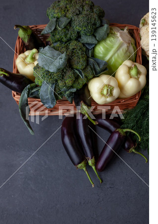 Healthy food. Fresh vegetables on the table black background. Set of food clean eating. Broccoli, cabbage, eggplant, white cabbage, cucumber, onions, beets, dill, cauliflower. Top view. Copy space. Healthy food. Fresh vegetables on the table black background. Set of food clean eating. Broccoli, cabbage, eggplant, white cabbage, cucumber, onions, beets, dill, cauliflower. Top view. Copy space. 139145623
