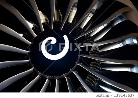 Turbine blades of an aircraft jet engine. Close up Turbines Engine. Aviation Technologies. Aircraft jet black detail during maintenance. Background Turbine blades of an aircraft jet engine. Close up Turbines Engine. Aviation Technologies. Aircraft jet black detail during maintenance. Background 139145637