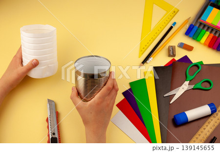 Step 4. Step-by-step instructions on how to make a stand for stationery from recycled materials. Do it yourself. A glass for pencils and pens from a plastic bottle and a can. A fun craft for kids DIY 139145655