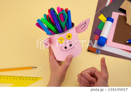 Step 30. Step-by-step instructions on how to make a stand for stationery from recycled materials. Do it yourself. A glass for pencils and pens from a plastic bottle and a can. A fun craft for kids DIY 139145657