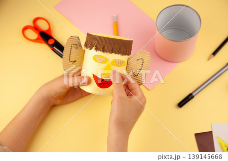 Step 22. Step-by-step instructions on how to make a stand for stationery from recycled materials. Do it yourself. A glass for pencils and pens from a plastic bottle and a can. A fun craft for kids DIY 139145668