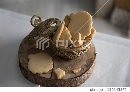 Homemade Christmas cookies in ceramic basket with festive decoration 139145873