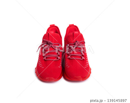 pair of red sneakers on a white isolated background. Sports shoes for running and sports. 139145897