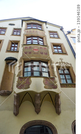 Historic facades at old street of Innsbruck view, alpine city in Tirol, region of Austria Historic facades at old street of Innsbruck view, alpine city in Tirol, region of Austria 139146189