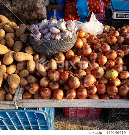 Onions, Potatoes and Garlic at Outdoor Market Stall 139146419
