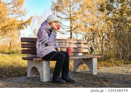 old age, retirement and people concept - close up of happy senior woman at autumn park drinking takeaway coffee 139146479