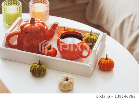 Autumnal living room decor with pumpkins, tea set and cake. Autumnal living room decor with pumpkins, tea set and cake. 139146768