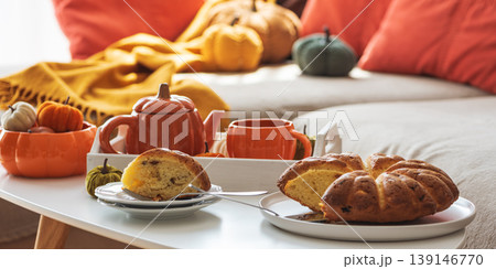 Autumnal living room decor with pumpkins, tea set and cake. Autumnal living room decor with pumpkins, tea set and cake. 139146770