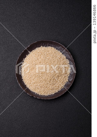 White sesame seeds in a bowl, an ingredient for oil and healthy eating. White sesame 139146866