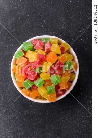 Candied fruit in colorful cubes as an ingredient for baked goods and sweets. Candied fruit Candied fruit in colorful cubes as an ingredient for baked goods and sweets. Candied fruit 139146912