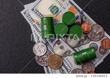 A barrel of oil against a backdrop of dollars as a concept for the oil crisis. A barrel of oil A barrel of oil against a backdrop of dollars as a concept for the oil crisis. A barrel of oil 139146953