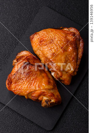 Grilled or barbecued chicken legs, spicy meat cooked with salt and spices. Grilled chicken legs Grilled or barbecued chicken legs, spicy meat cooked with salt and spices. Grilled chicken legs 139146956