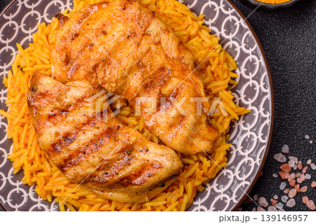 Kabsa or haneeth, an Arabic dish with rice and chicken, salt, and spices. Kabsa or haneeth Kabsa or haneeth, an Arabic dish with rice and chicken, salt, and spices. Kabsa or haneeth 139146957
