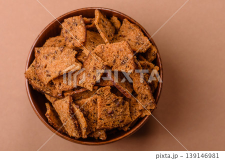 Croutons or crackers made from rye bread with garlic, salt, and spices. Croutons with salt Croutons or crackers made from rye bread with garlic, salt, and spices. Croutons with salt 139146981