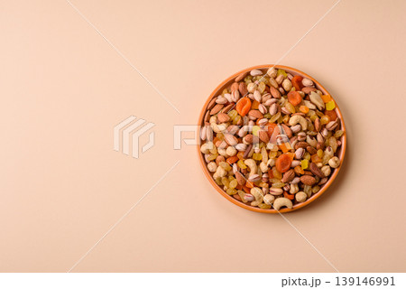 A mix of nuts and dried fruits as ingredients for a healthy meal. Nuts and dried fruits 139146991