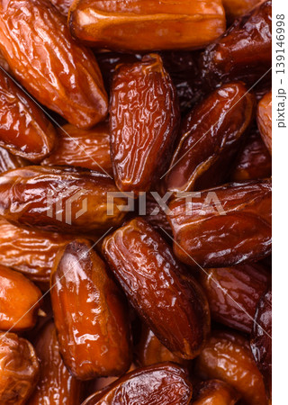 Dried dates on a ceramic plate for Ramadan or Iftar. Dates fruit as a background Dried dates on a ceramic plate for Ramadan or Iftar. Dates fruit as a background 139146998
