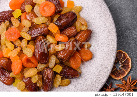 Dried apricots, raisins, and candied fruits as ingredients for baked goods and sweets. Dried fruits Dried apricots, raisins, and candied fruits as ingredients for baked goods and sweets. Dried fruits 139147001