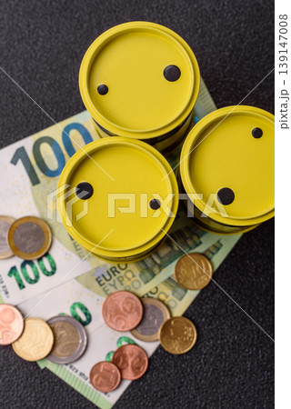 A barrel of oil against a backdrop of euro as a concept for the oil crisis. A barrel of oil A barrel of oil against a backdrop of euro as a concept for the oil crisis. A barrel of oil 139147008