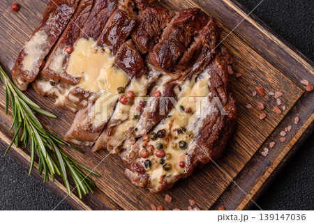 Steak, beef or pork meat grilled or barbecued with salt and spices. Beef steak Steak, beef or pork meat grilled or barbecued with salt and spices. Beef steak 139147036